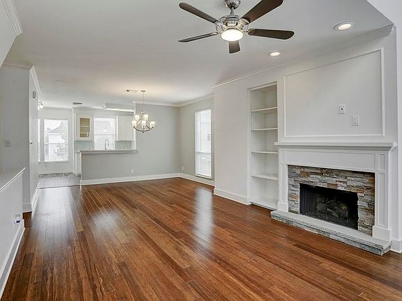 Just look at the gleaming Hardwood Flooring in this Open Concept home, showing family room, dining room and kitchen.