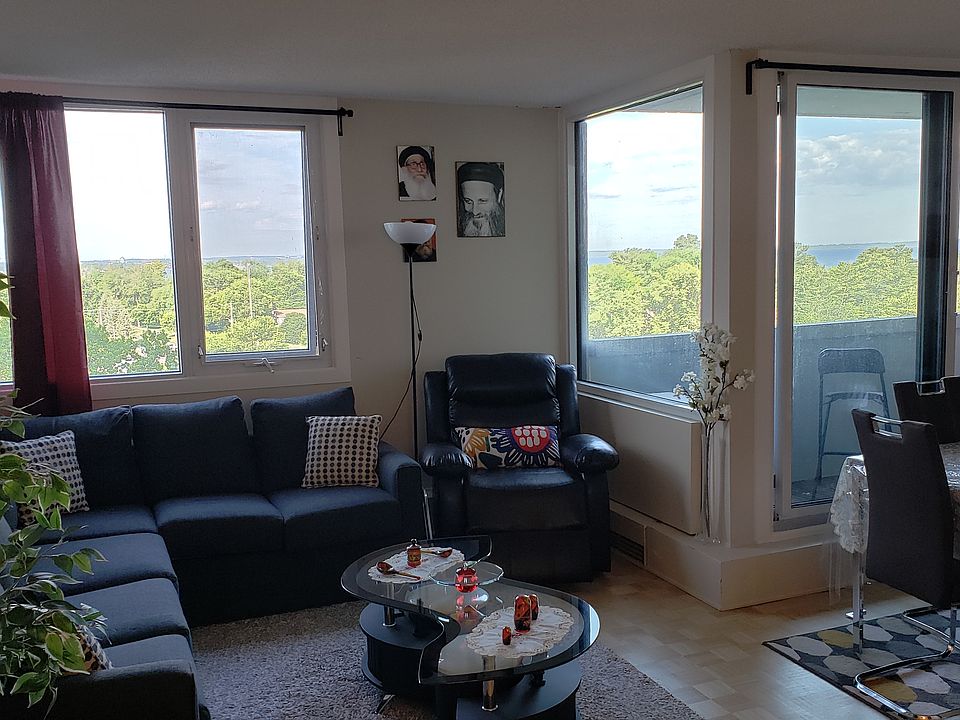 View of the spacious & bright living and dining room with balcony and the view.