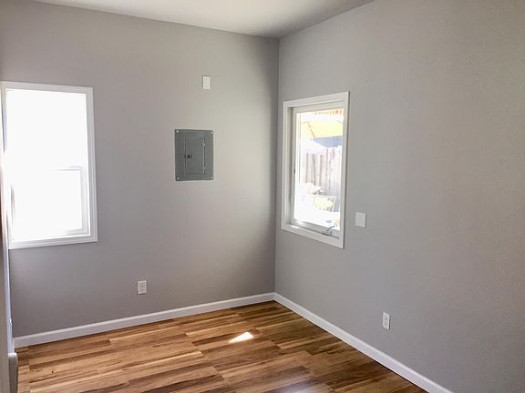 Master bedroom is 14.5 x 9 feet. A queen bed and nightstands