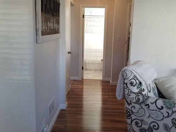 Hallway from living room to kitchen bedroom bath