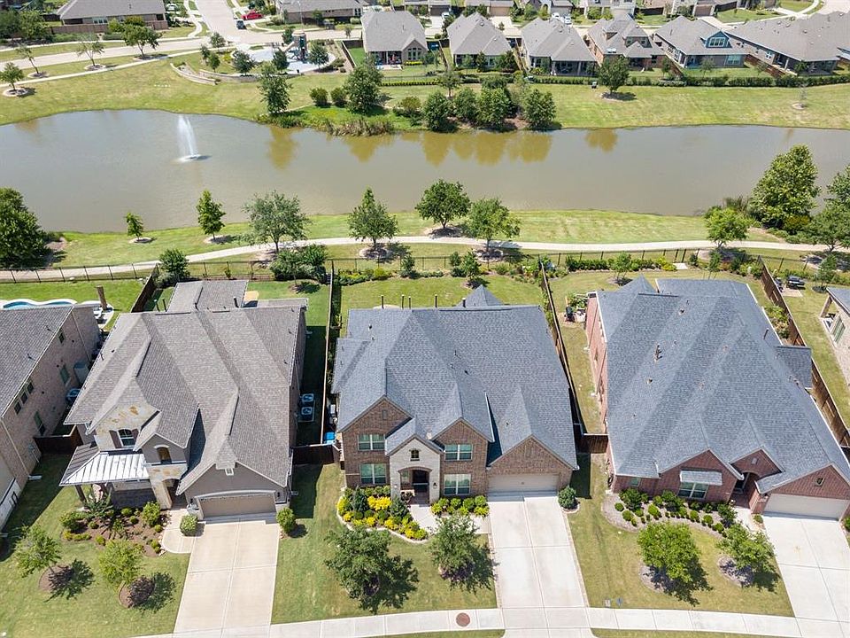 Welcome to 6514 Abilene Drive in the Outstanding Community of Cane Island. This beauty has approximately $40,000 worth of upgrades since purchased all backing to a wonderful lake and walking trail.