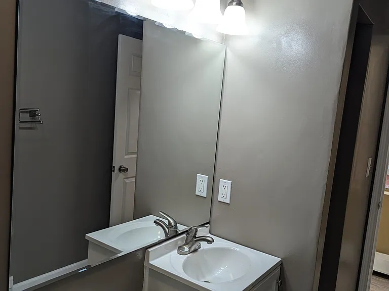 Bathroom with large mirror