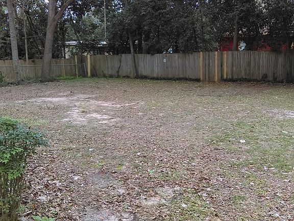 Large private backyard with deck