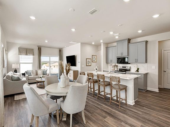 Step inside the Roswell apos s, bright open-concept living space.