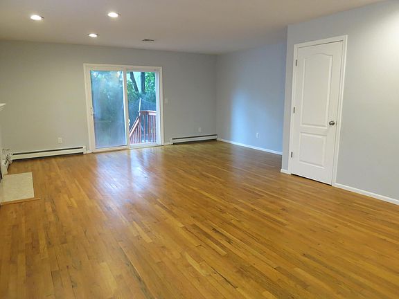 Living/dining room with sliders to backyard