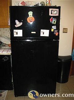 Freshly painted kitchen offers a new Refrigerator and Stove