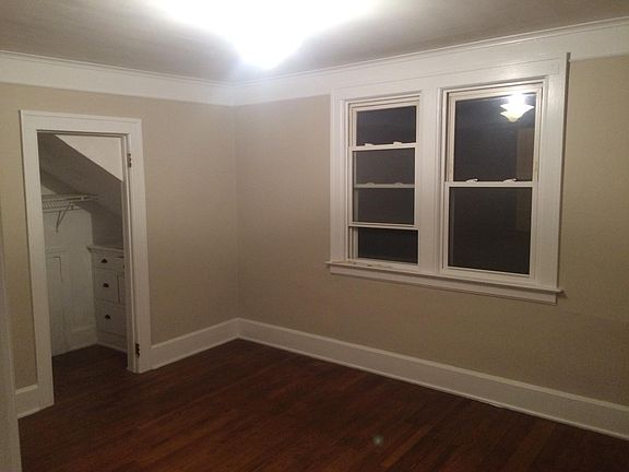 Bedroom with built in drawers in closet
