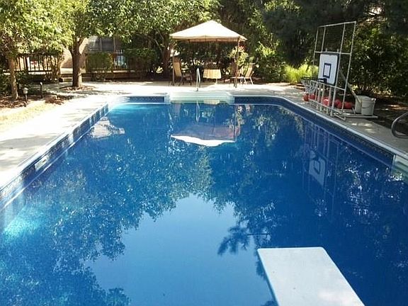 Steps at cabana end and 3.5 ft deep down to 8.5 ft at diving end.