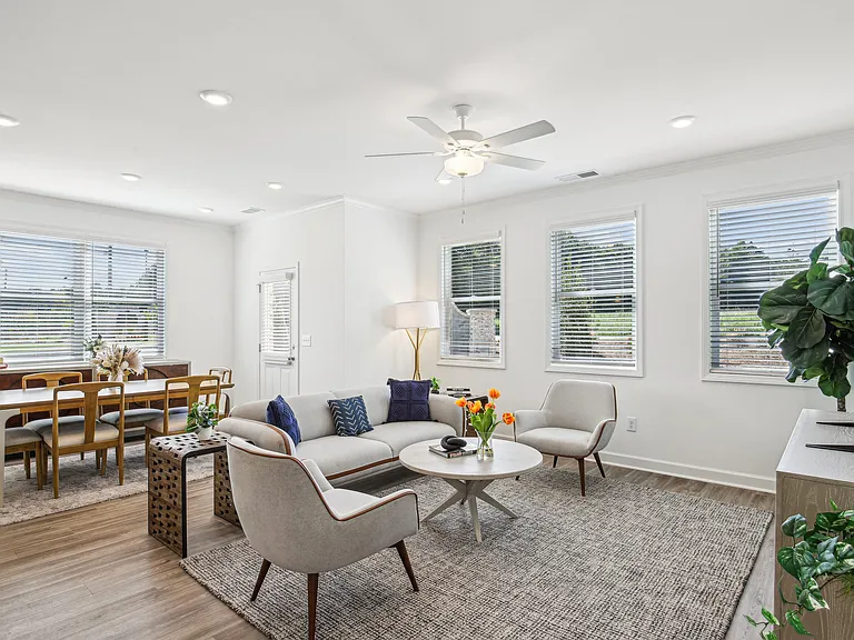 Living room with large window letting in a ton of natural light.