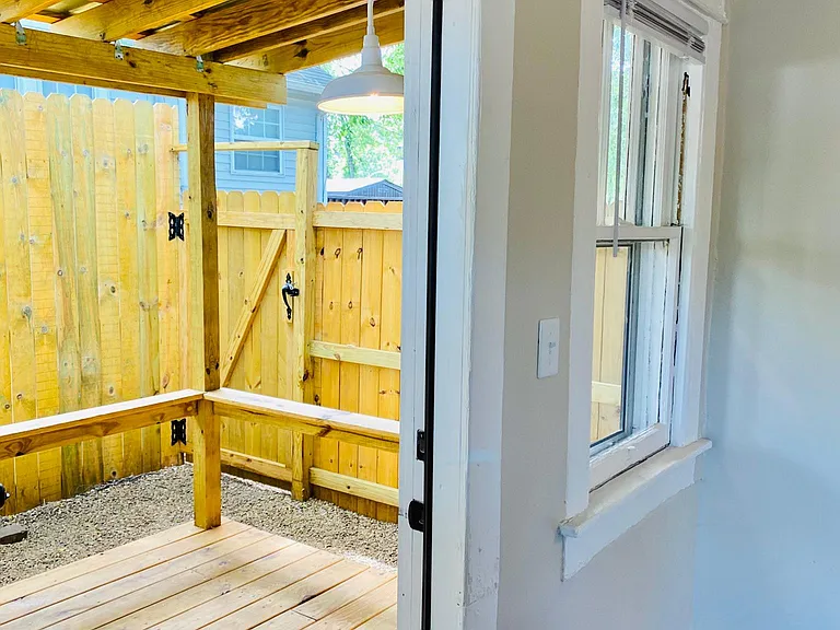 Covered porch connects to living room