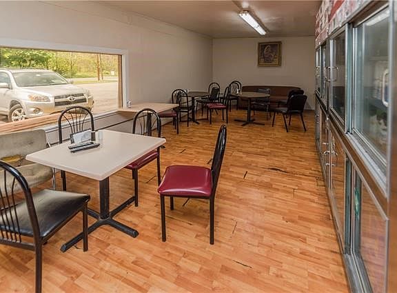 Or, customers have the opportunity to take a break and eat in the dinning area or sit on a couch and watch a television mounted 