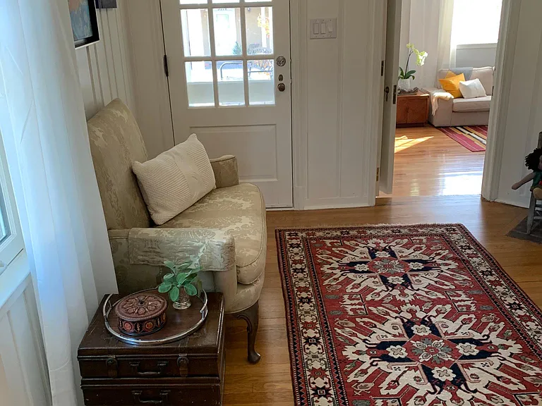 Library off main entrance flowing to master suite downstairs. Library with fireplace, built in bookshelves & TV for entertainment