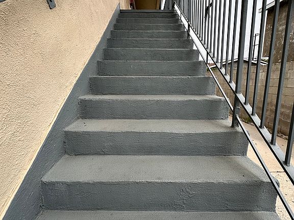 Stairs up to the apartment (in front of the complex)