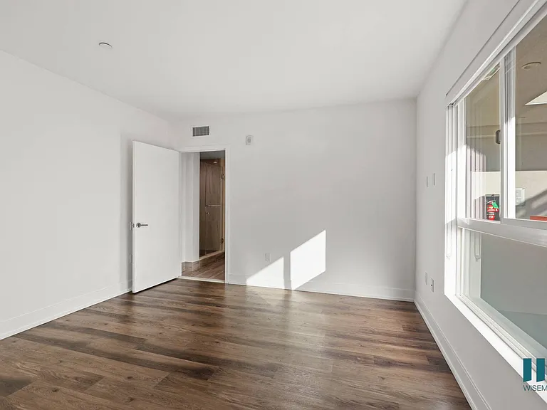 Bedroom with Recessed Lighting, Vinyl Flooring, and Large Windows