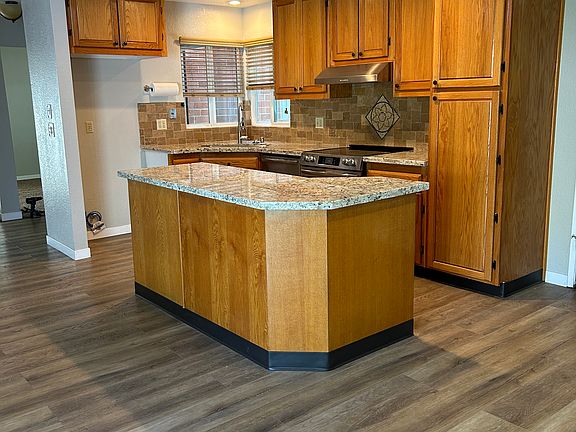 Kitchen with new counters/appliances.