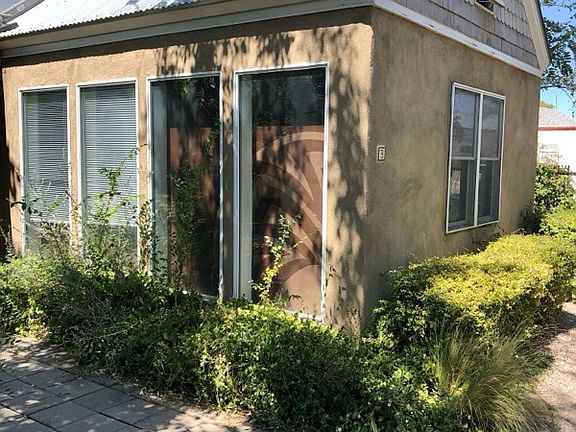 Great room windows have view of courtyard plus energy efficient heat wall on inside.