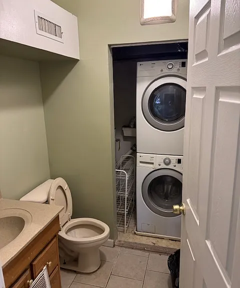 Full bath with utility closet housing the heat pump; hot water heater; washer and dryer unit (2nd fl)