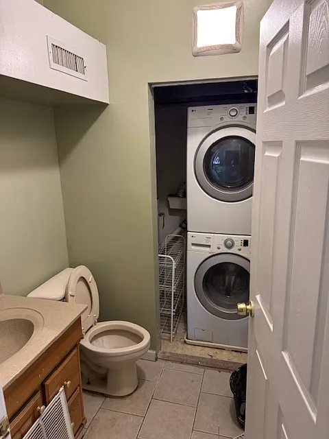 Full bath with utility closet housing the heat pump; hot water heater; washer and dryer unit (2nd fl)