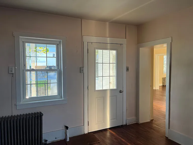 Door into home form walkway, into kitchen, looking into dining room and family room on the right