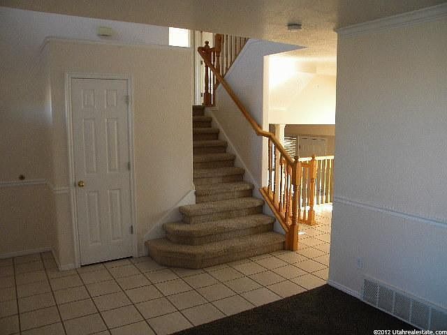 Tiled entry and staircace