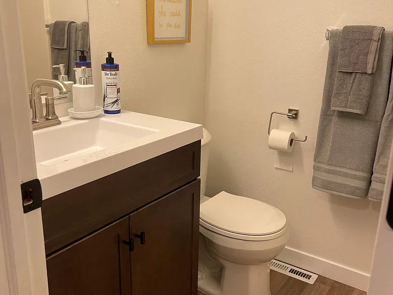 bathroom, new toilet, new faucet -sink-cabinets. Located in Gold Room Bedroom 1. *3 of the 4 bedrooms have their own bathroom and walk in closet located in the bedroom. Huge rooms!
