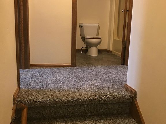 View from stairs into full bath