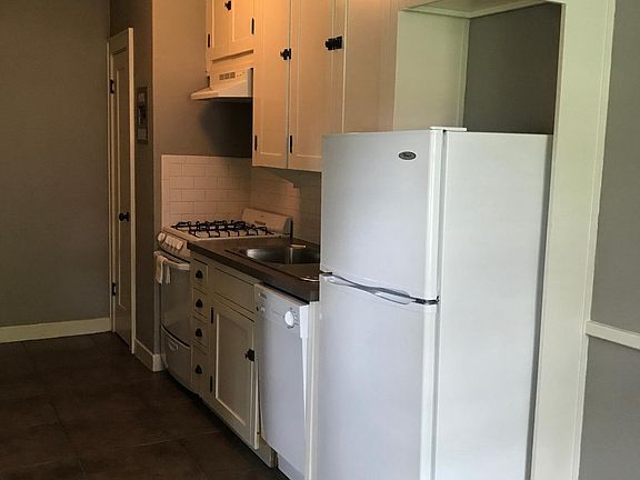 Kitchen with dishwasher, fridge, and gas stove!