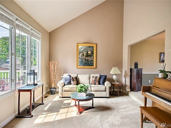 Spacious living room with vaulted ceilings & lot of natural light