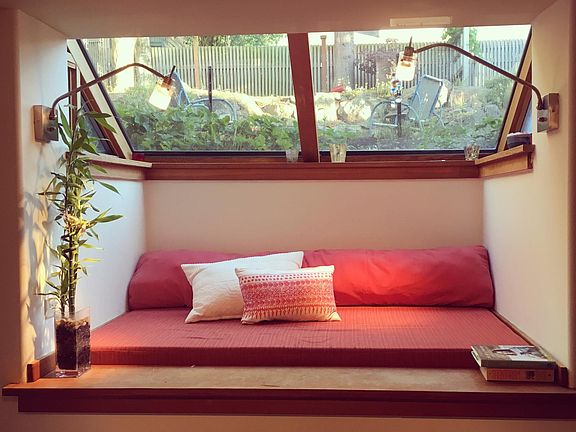 South facing window seat (easy to curtain off for privacy).