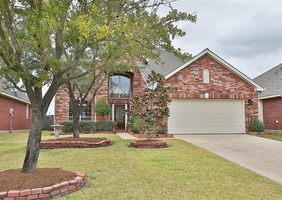 Welcome home to 12822 Carriage Glen Drive in the beautiful neighborhood of Village Creek with parks, trails, lake, swimming pool and splash pad.