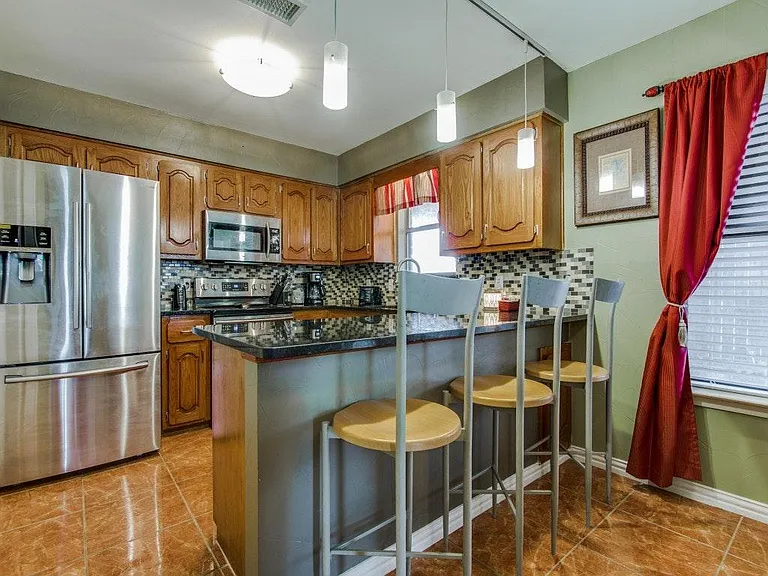 Modern and updated Kitchen with granite tops and stainless s