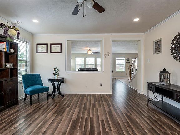 Once inside, beautiful laminate flooring flows from the entry into the formal living, dining room and family room! This home has recent fresh paint and these updated laminate floors!