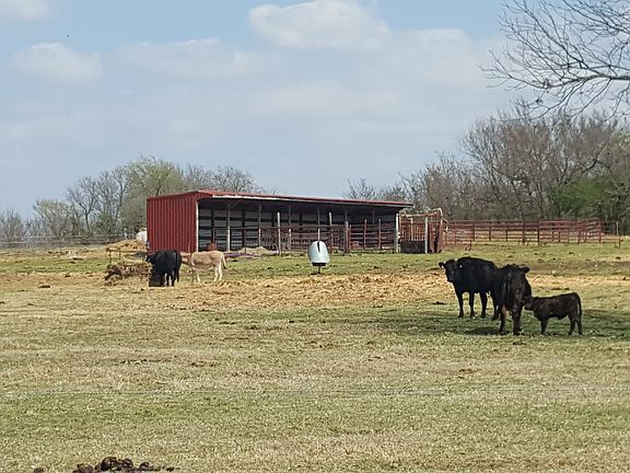 Open barn, hay trap behind barn