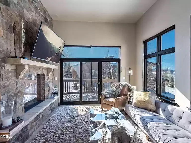 gorgeous stone gas fireplace offers a luxurious feel