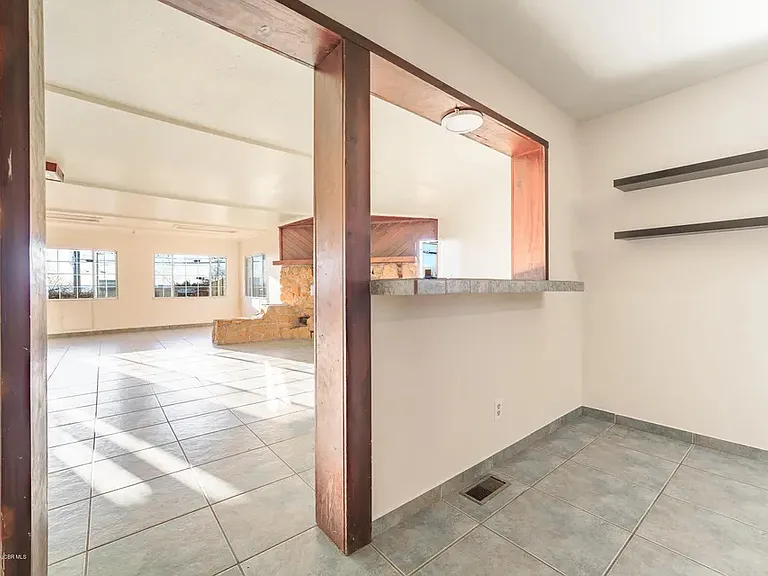 The double-sided breakfast nook opens to the stunning entertainment room.