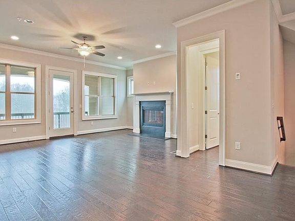 Family Room with Fireplace, Powder Room and Covered Deck