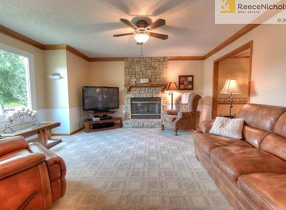 Spacious great room with stone fireplace