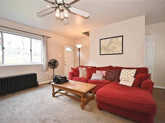 Huge window in spacious living room brings tons of light to the space