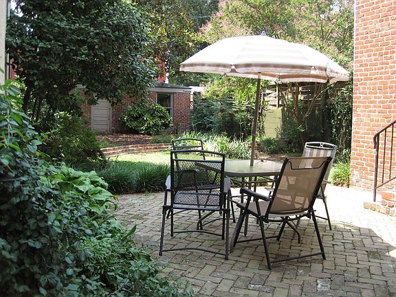 Terrace with view of garden. Note garage in background.
