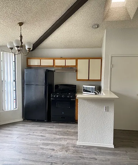 Refrigerator, stove and microwave.
There is a stainless steel sink with a disposal.