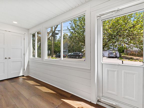 Three season sun porch with large cedar closet.