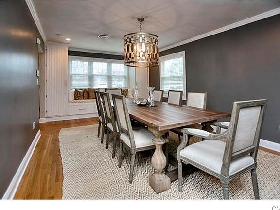 dining Room with built ins and large windows