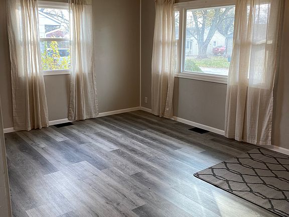Open family room with updated flooring and paint.