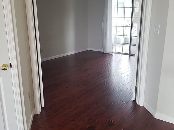 The upstairs primary suite includes a spacious walk-in closet and its own west-facing deck with mountain views and stunning sunset skies~