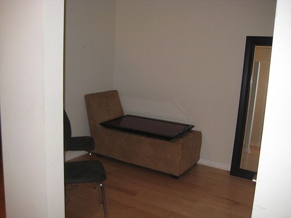 Den as you walk in on the right