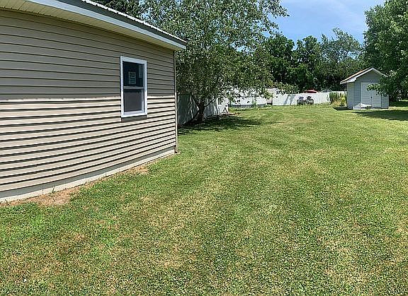 Side yard with blue shed