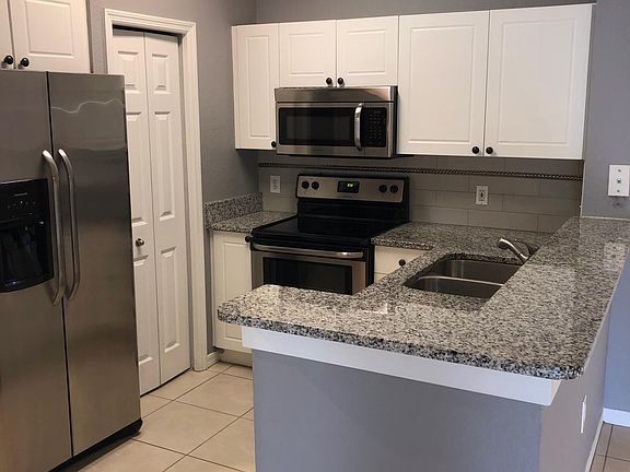 Kitchen with stainless steel appliances.