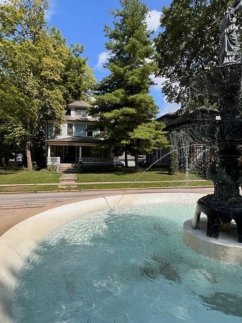 Fountain in front of apartment.