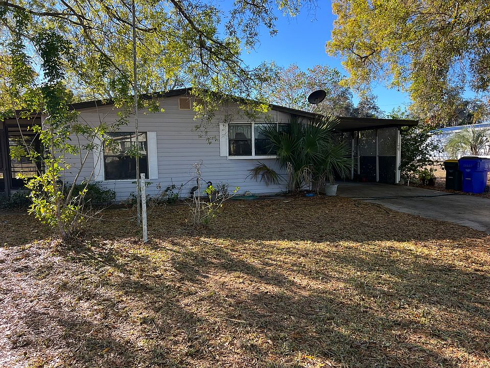 Front exterior with carport