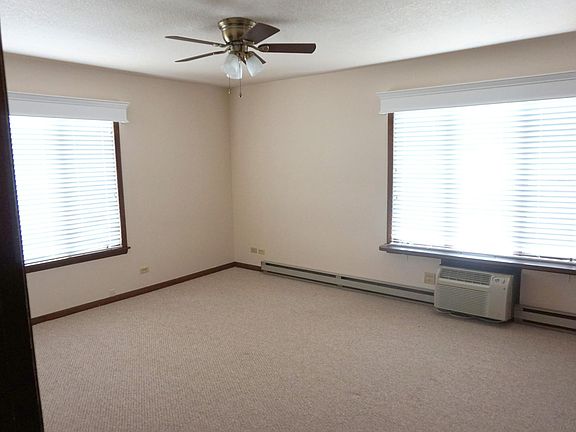 Bedroom overlooks Main Street and faces west. Bedroom also has two big closets, ceiling fan, separate air conditioner and plenty of space for a bed and dresser.